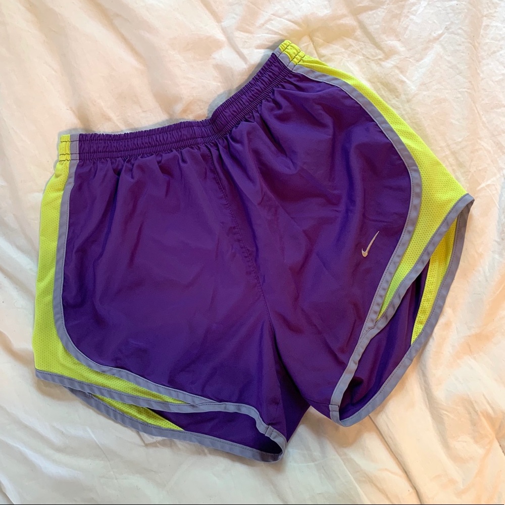 Purple, lavender, and neon yellow Nike Tempo short